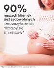 Aplikacja kremu na rozstępy Cellublue na skórę brzucha