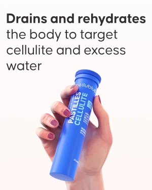 Effervescent cellulite tablet dissolving in glass of water